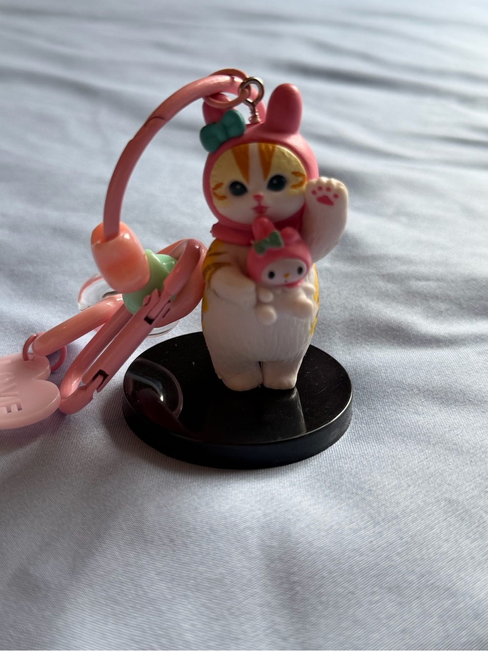 Mofu holding My Melody Keychain/ Figurine Charm with stand.